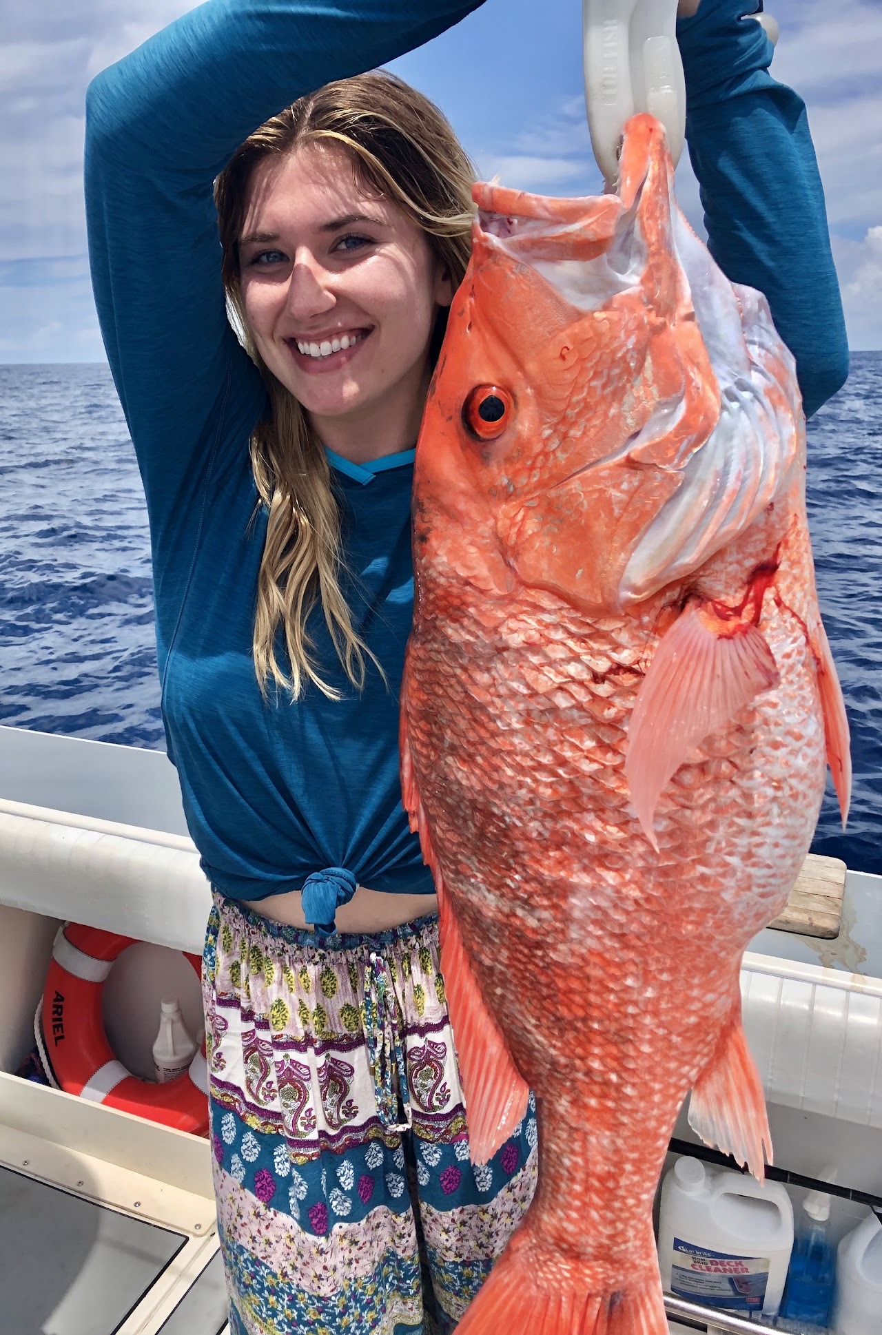 An angler with a red fish