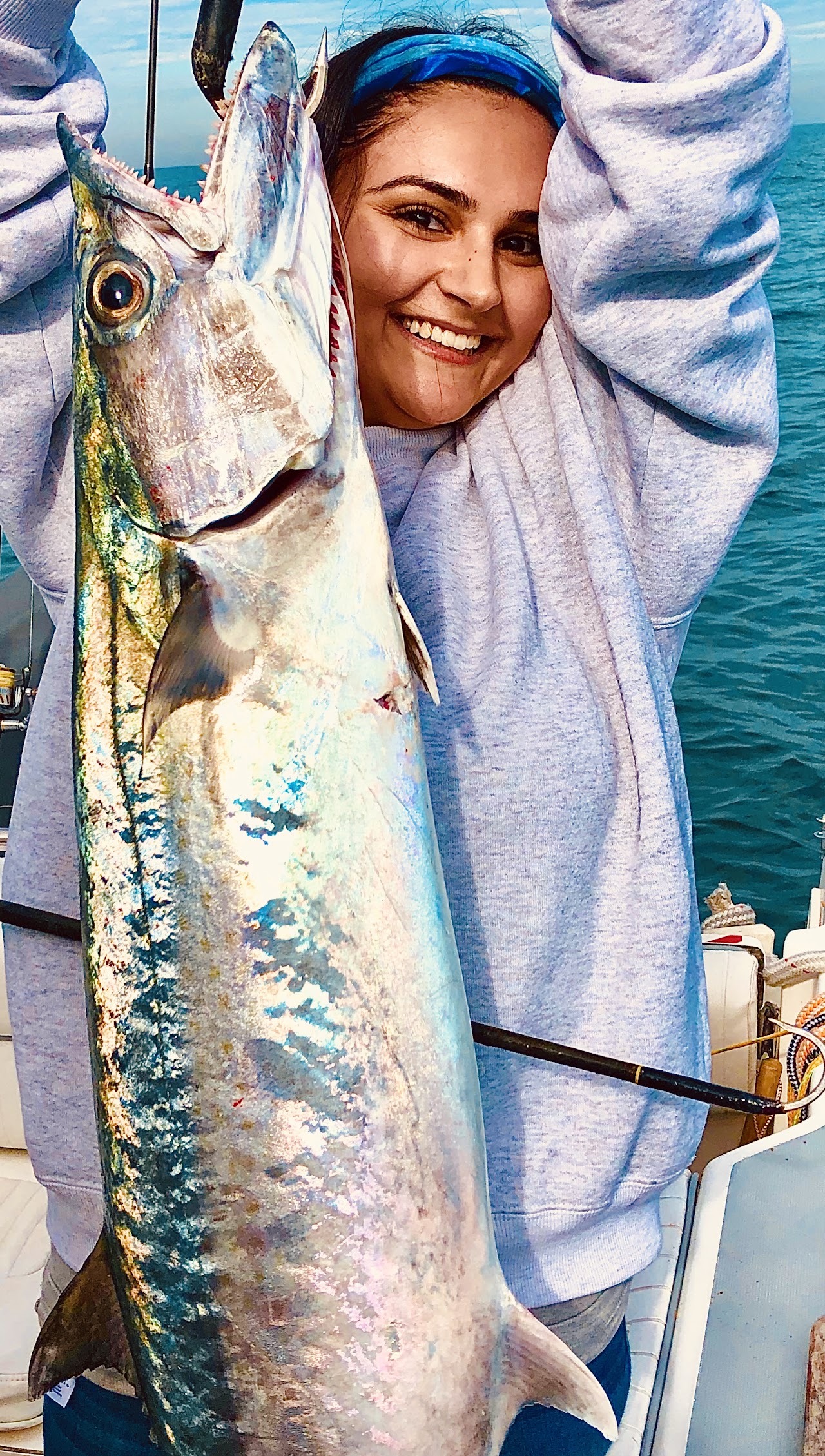 An angler displaying a long fish